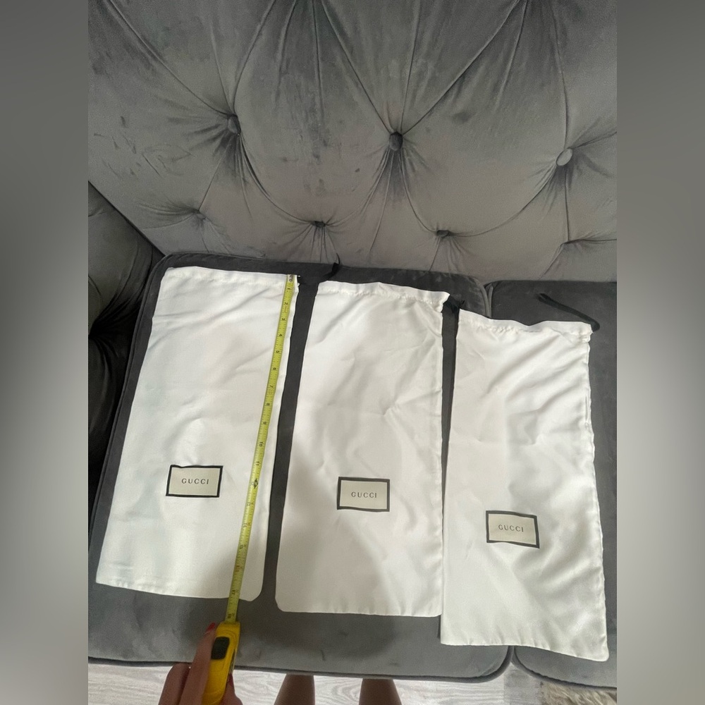 THREE GUCCI DUST BAGS